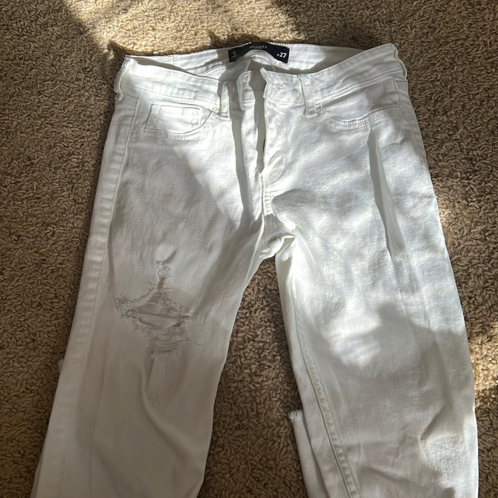 White pants with rips